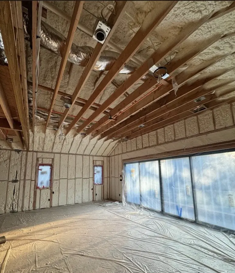 Interior walls and ceiling insulated with spray foam during new construction in Summit